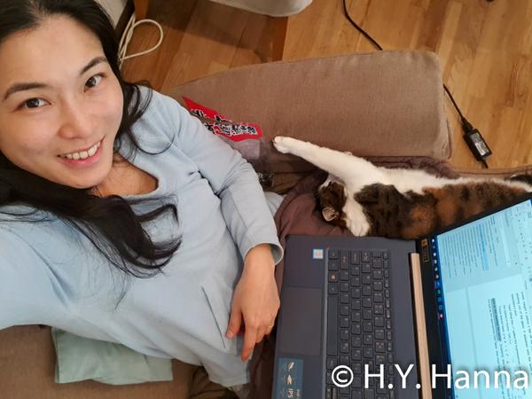 Hsin-Yi & Muesli working on a book