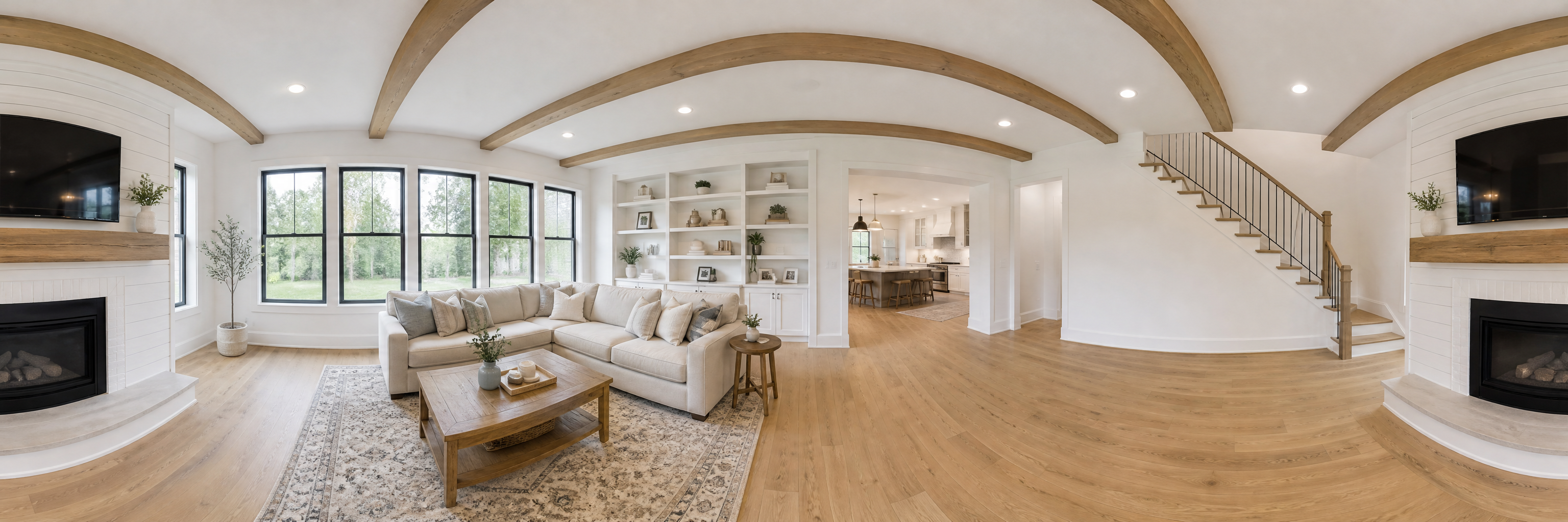 360 degree view of a bright farmhouse living room with a white shiplap fireplace, cream sofa and large windows