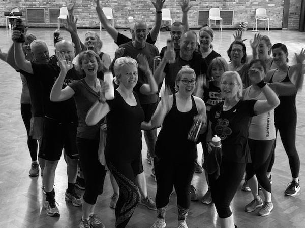 Group fitness class
with smiling participants