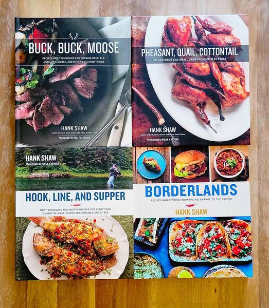Four of Hank Shaw's cookbooks.