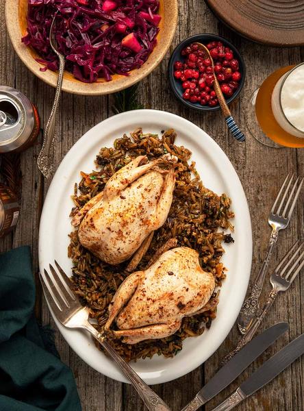 Roast grouse on a bed of wild rice. 