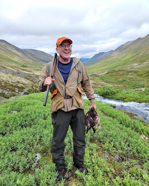Me with a willow ptarmigan in Alaska, last year. 
