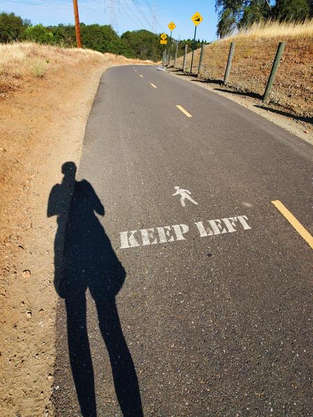 Holly's long shadow on a fitness walk 