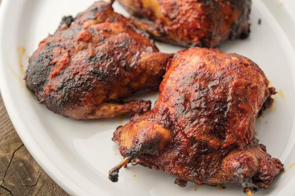 Grilled teal ducks on a plate. 