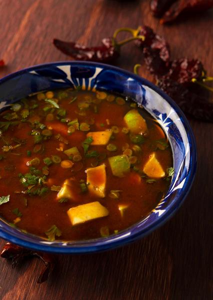 A bowl of caldo de camaron, Mexican shrimp soup. 