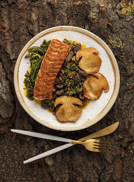 A plate of trout, porcini, morels and bracken fern