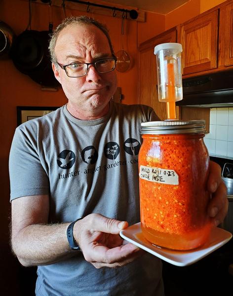 Hank with a chili paste that's fermenting too vigorously