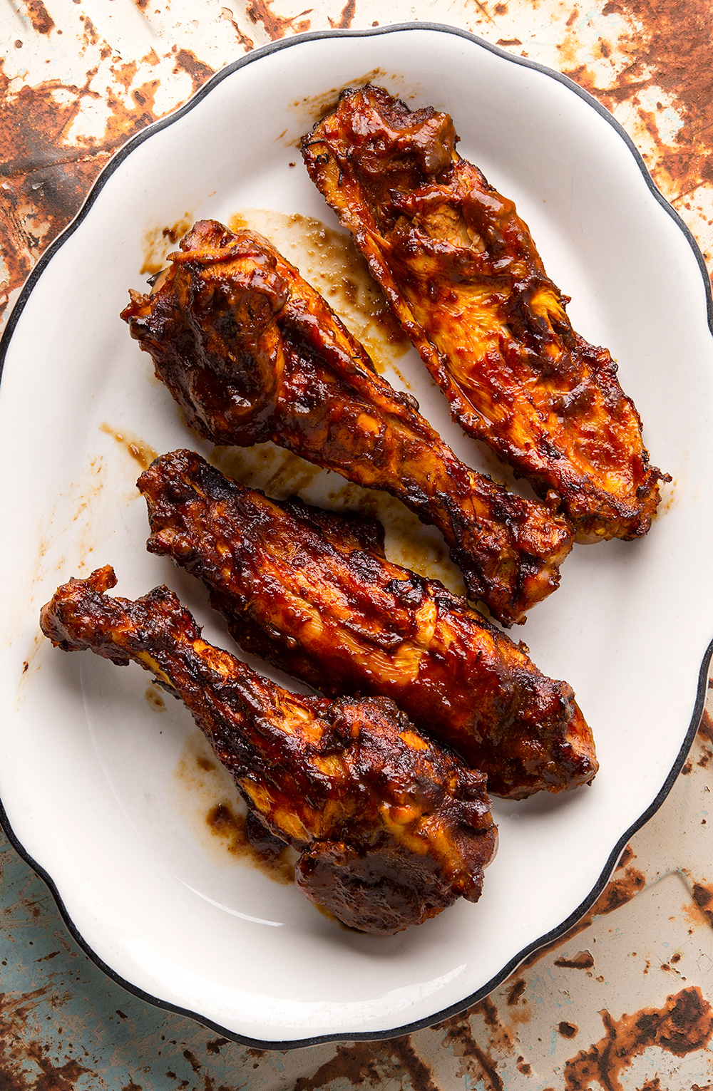 Smoked BBQ turkey wings on a platter. 