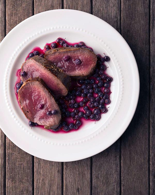 Pickled blueberries with venison steaks. 