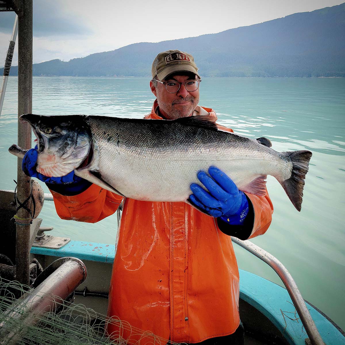 Hank Shaw holding a huge coho salmon. 