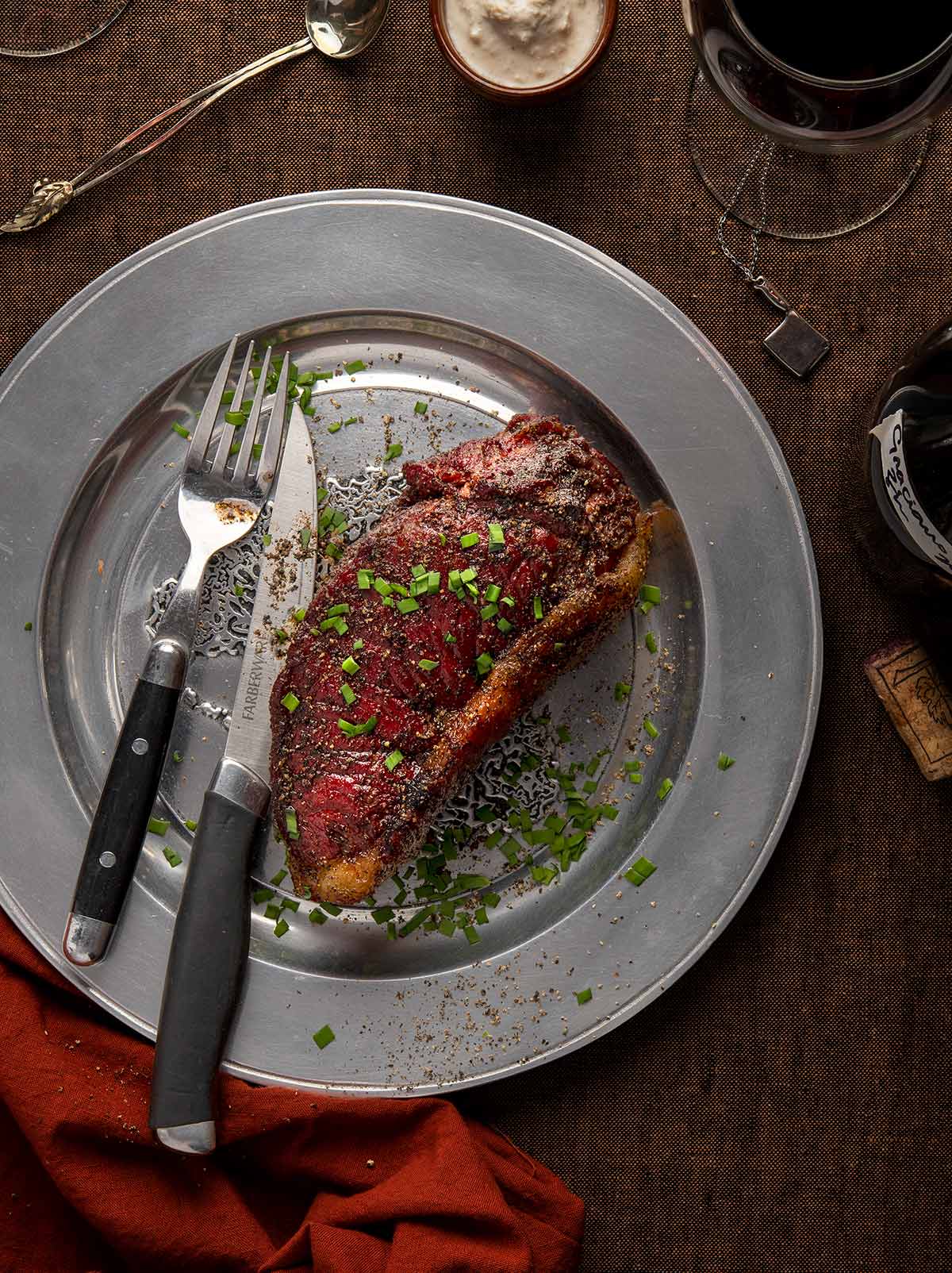 Bison steak on a steel plate. 