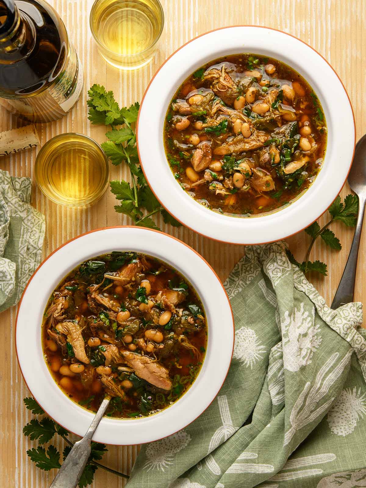 Two bowls of green chile chicken soup.