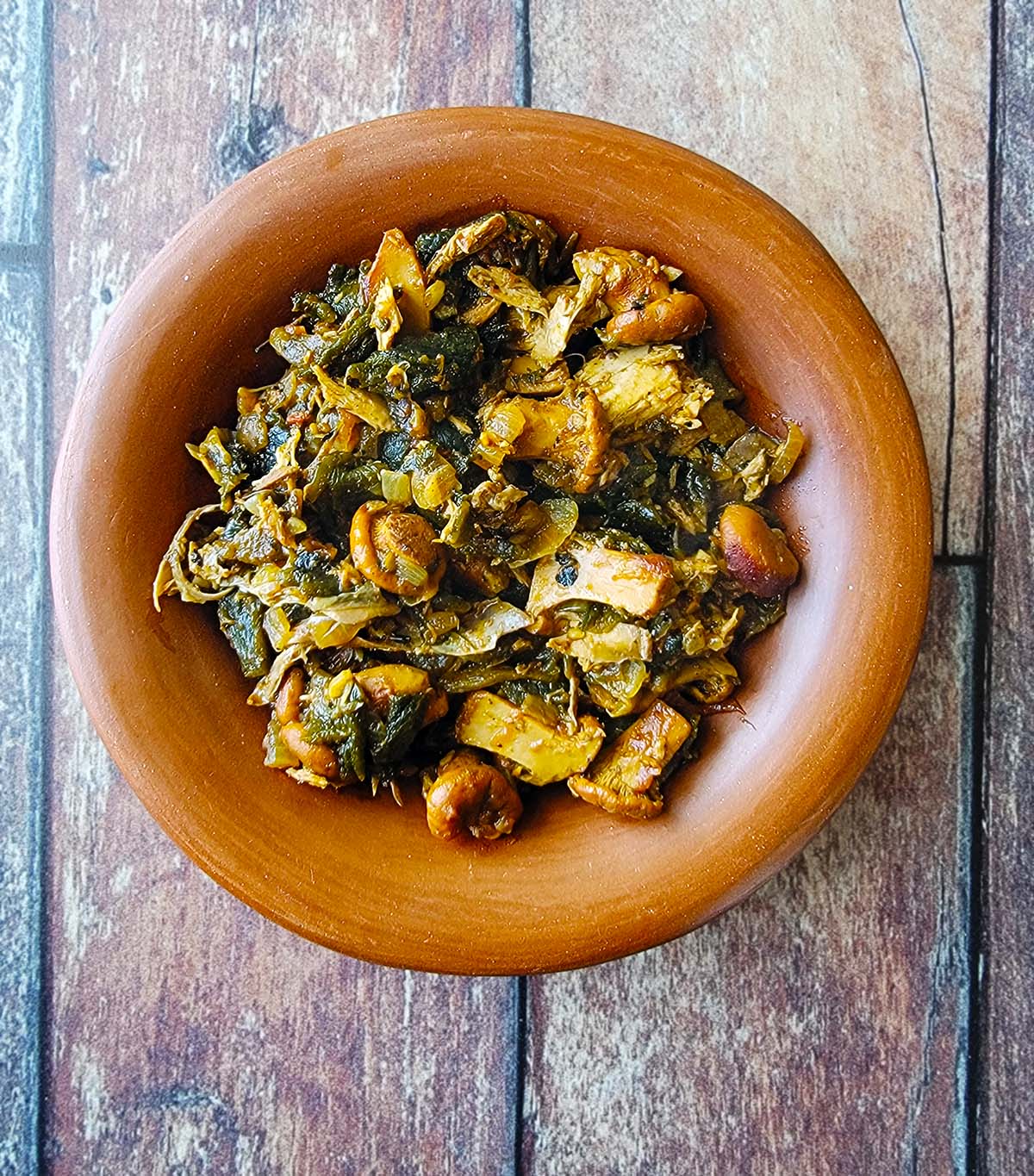 Tarahumara mushrooms and greens in a bowl.