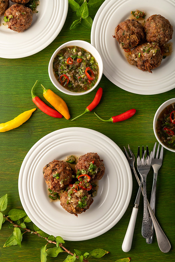 Plates of Thai meatballs with dipping sauce. 