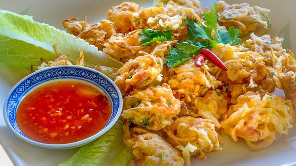 In the South of Bangkok there is a beautiful canal where farmers sell their produce to farmers gliding by on classic Thai boats.