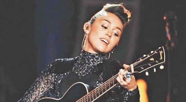 Prepare To Be Amazed By Miley Cyrus' 'Boots Are Made For Walkin'' Cover