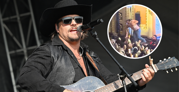 Gavin Adcock Takes A Hard Fall Off Stage, Powers Through & Keeps Singing