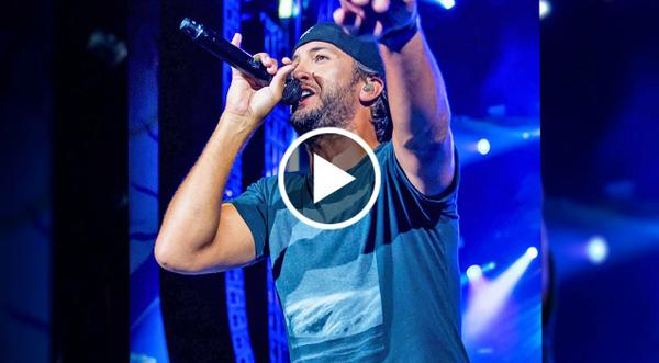 Luke Bryan’s Reaction To Seeing Fan Hold Up Blake Shelton Shirt At Show Is Priceless