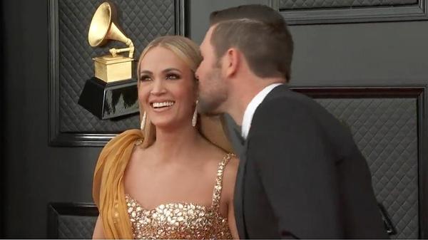 Carrie Underwood Stuns In Massive Gold Ball Gown On Grammy Red Carpet