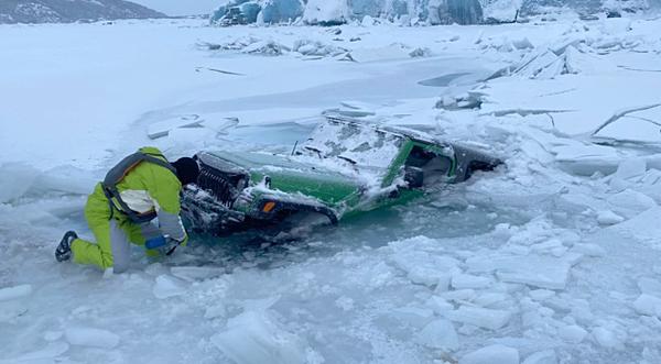 Jeep Partially Falls Through Ice Into 600-Foot-Deep Lake