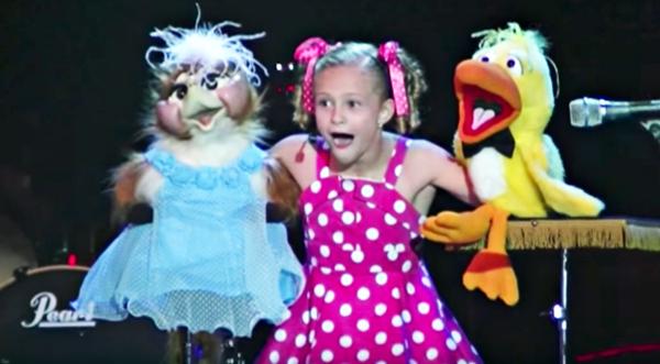 Darci Lynn Juggles Two Feisty Puppets In Adorable Sing-Song Routine
