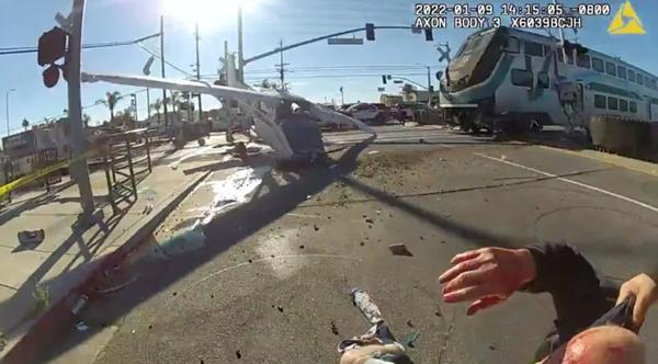 Cops Pulls Pilot Out Of Crashed Plane Seconds Before Train Hits