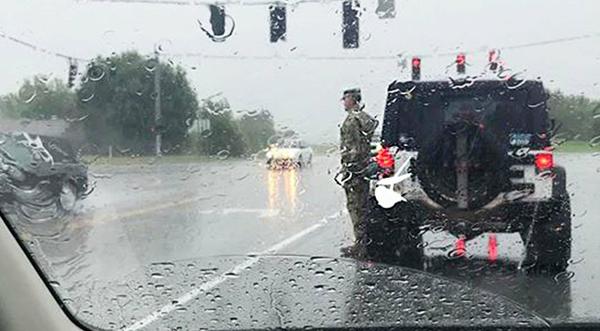 Soldier Exits SUV & Stands At Attention In Intersection For Fallen Comrade