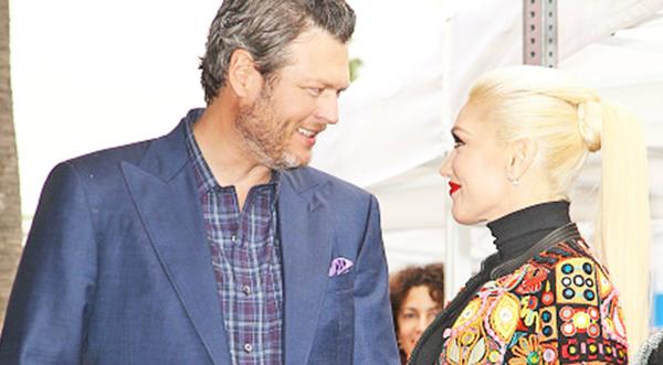 Blake Shelton & Gwen Stefani's Son Rock Matching Outfits While Fishing