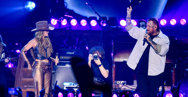 Jelly Roll Makes Surprise Appearance At Lainey Wilson’s Concert, Calls Her “The Role Model Us Parents Were Praying For”