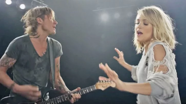 Carrie Underwood Shows Off Dance Moves In Flirty New Video For "The Fighter" With Keith Urban