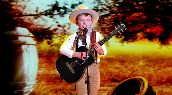 You’ve Got To Hear This 8-Year-Old Unleash Buck Owens’ “Tiger By The Tail”