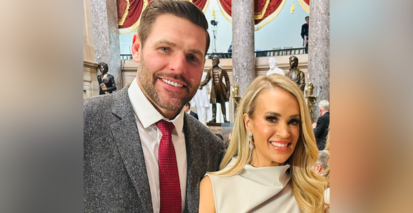 Carrie Underwood and Mike Fisher pose for a photo during the inaugural luncheon.
