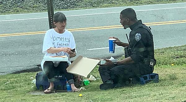 Police Officer Captured On Camera Buying & Eating Lunch With Homeless Lady
