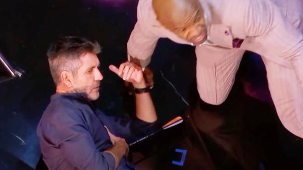 Simon Cowell Takes Arrow To Chest During “AGT” Prank