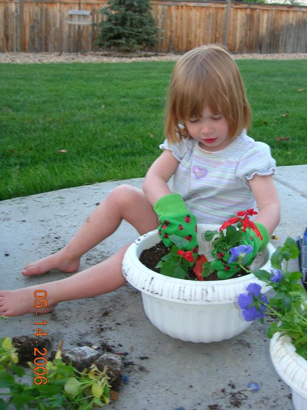 Dr Renee's daughter planting flowers