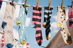 Colorful, patterned socks hanging on a clothesline