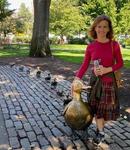 Dr Renee standing next to the "Make Way for Ducklings" row of ducks in Boston (yes, those ducks ARE in a row!)