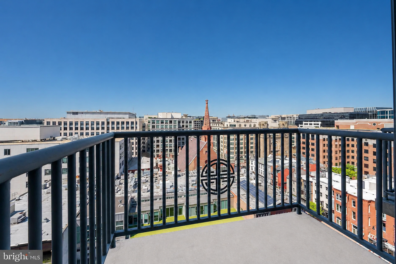 Balcony view overlooking DC rooftops and city skyline