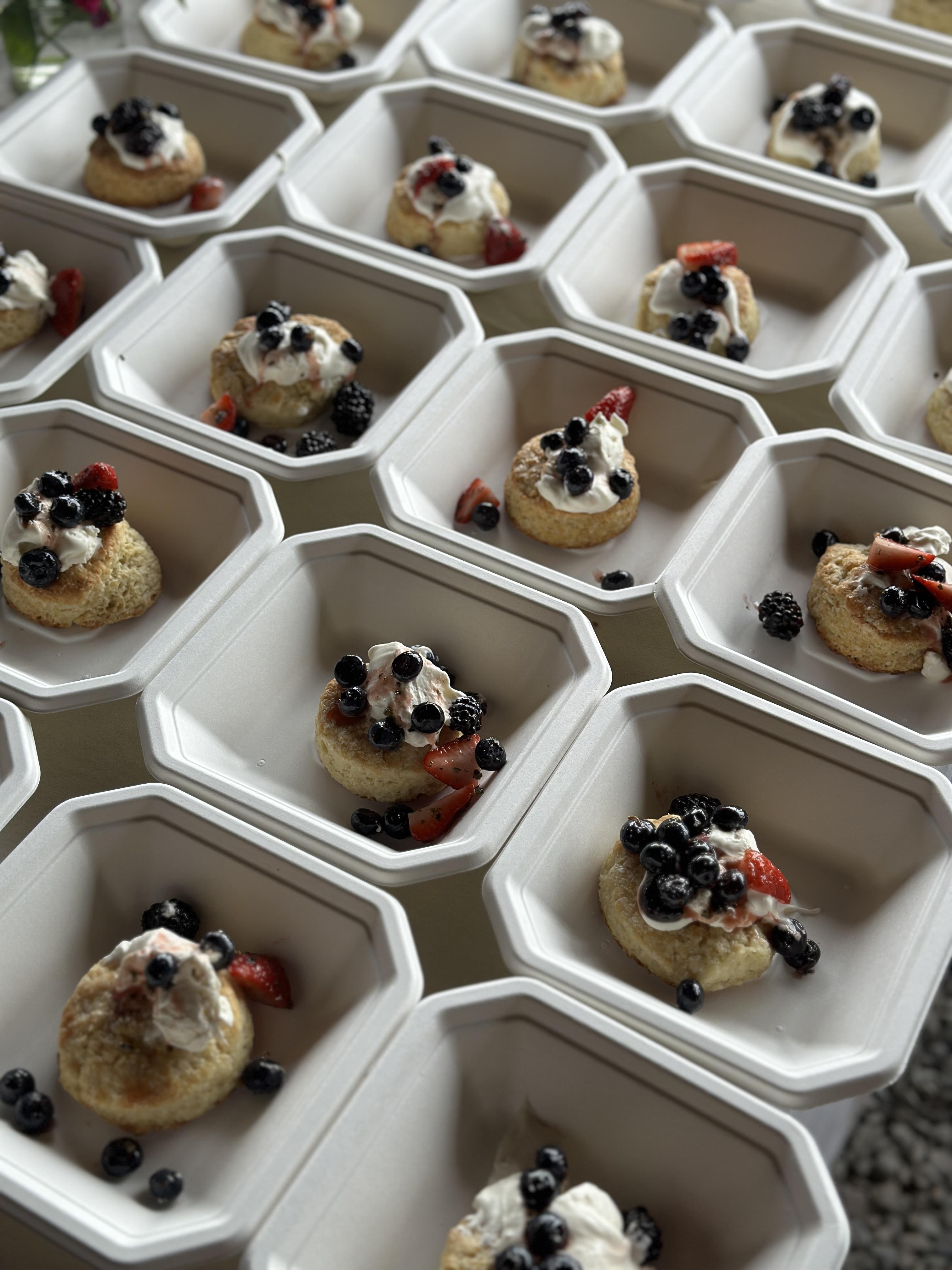 Rows of plated berry shortcakes ready to be served at a private dinner