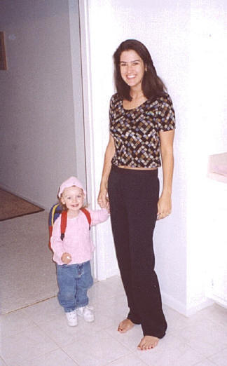 Amber after, 135 pounds and healthy, with her daughter