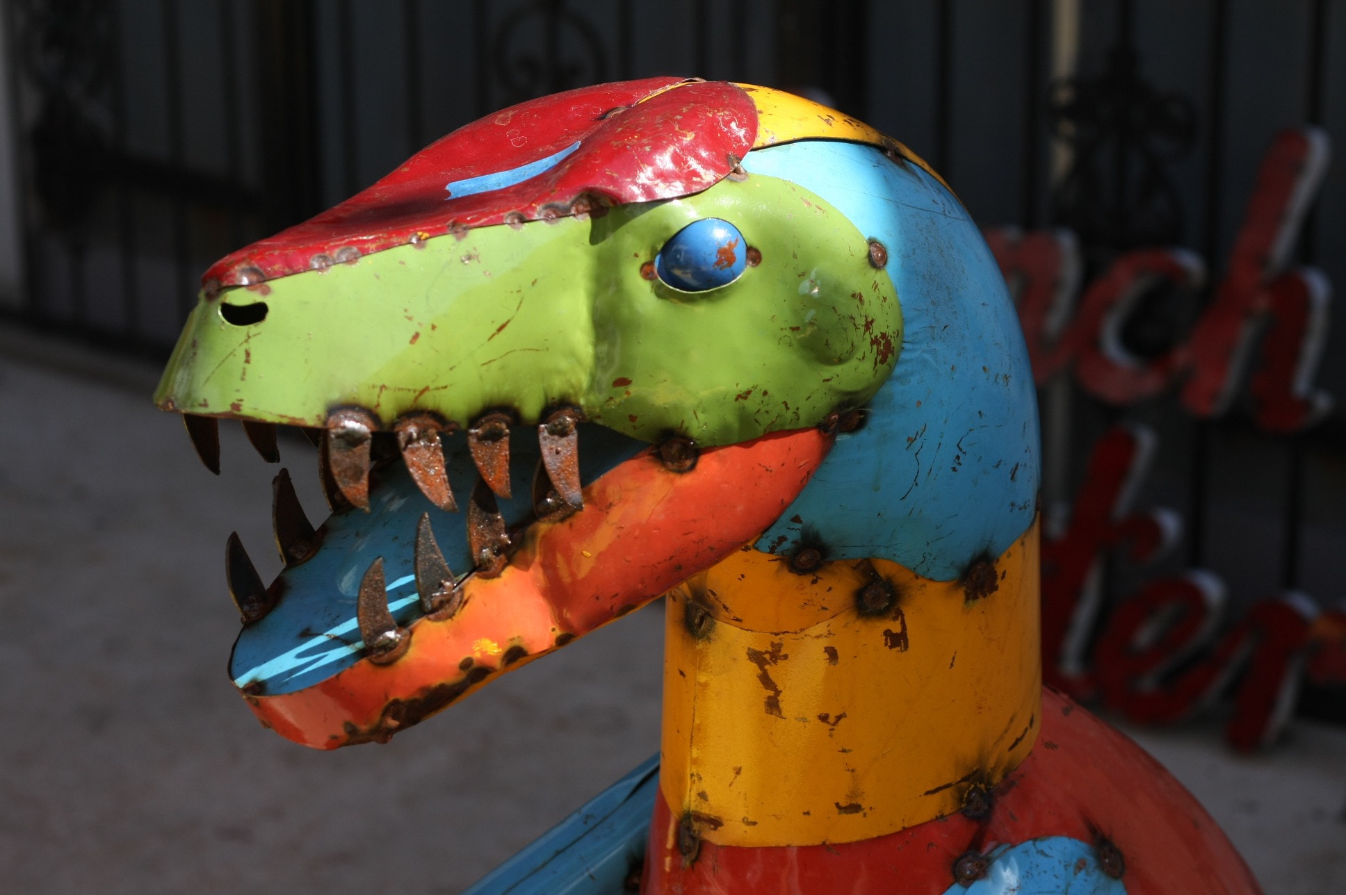 Colorful metal dinosaur sculpture
