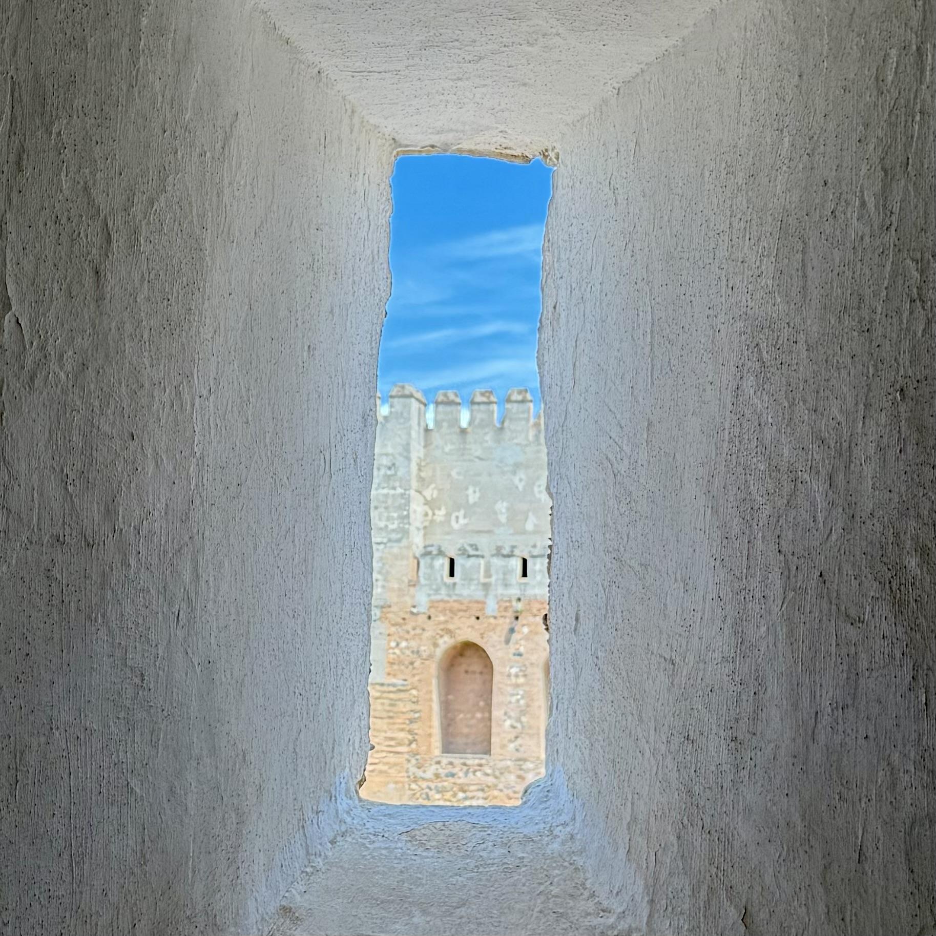 Castle tower through stone window