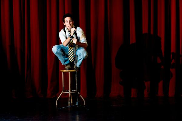 Man sitting on stage