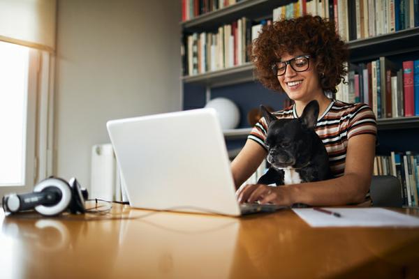 woman with laptop and dog