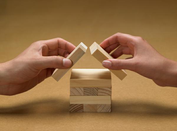 Hands building with blocks