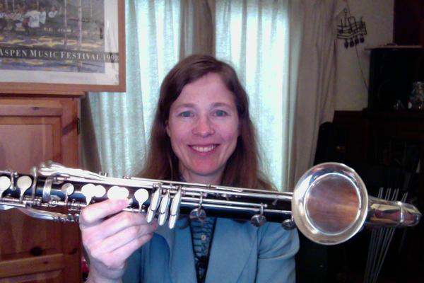 MIchelle Anderson holds up a basset horn