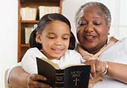 Grandma Reading Bible to Child